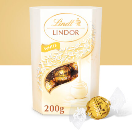 Four individually wrapped Lindor White Chocolates with elegant white and gold foil.