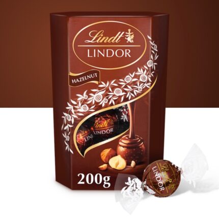 Four individually wrapped Lindor Hazelnut chocolates with luxurious golden packaging.