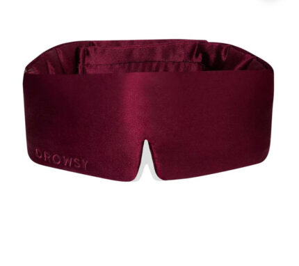 Plush Drowsy Sleep Mask in deep burgundy silk, designed for total blackout and ultimate comfort.