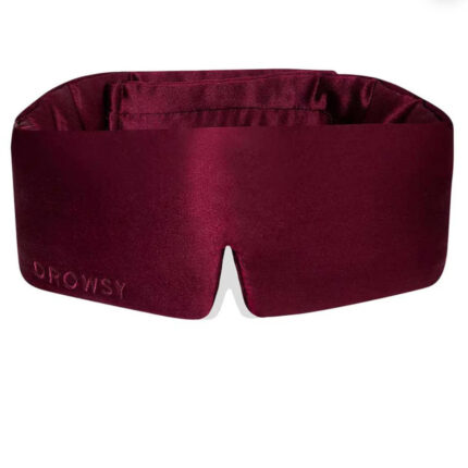 Plush Drowsy Sleep Mask in deep burgundy silk, designed for total blackout and ultimate comfort.