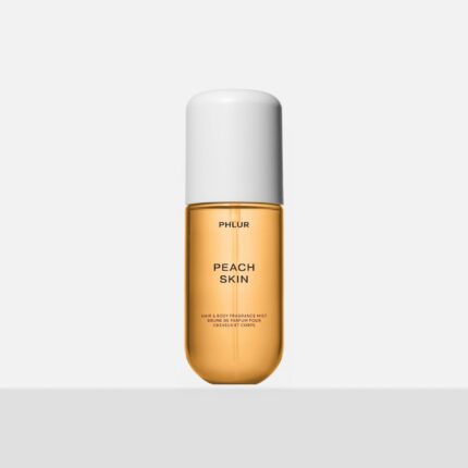Phlur Peach Skin hair and body mist bottle on neutral background