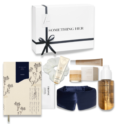 Sunday self-care box featuring a luxury sleep mask, notebook, body mist, lip balm, hand cream, silk scrunchie and more in a white gift box