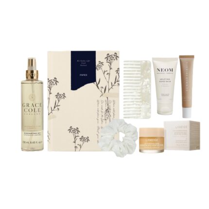 Evening self-care box with notebook, hand cream, lip balm, mist, comb, and silk scrunchie in a relaxing neutral-toned gift set