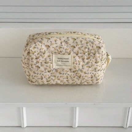 Yellow floral cosmetic bag with quilted texture