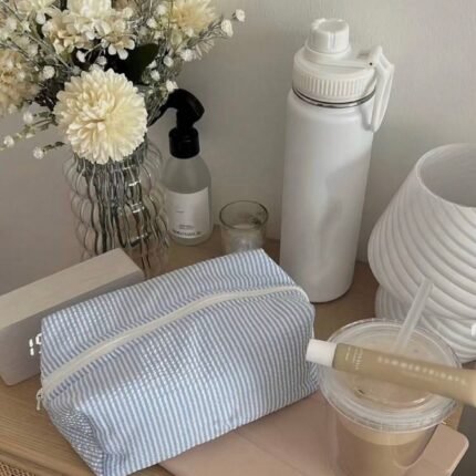 Quilted striped cotton cosmetic bag for makeup, skincare and travel essentials