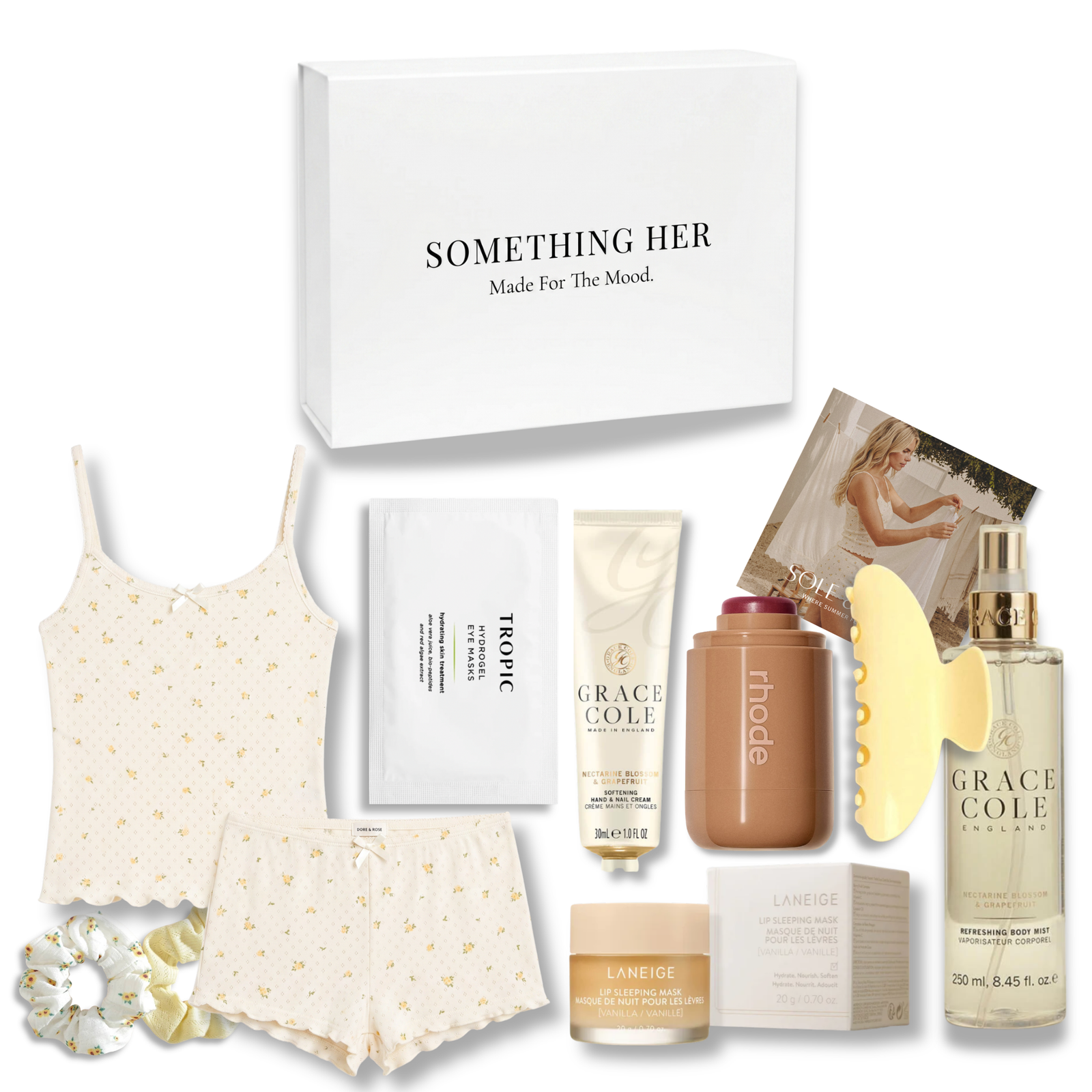 Soul & Linen relaxation gift box featuring pointelle sleepwear, skincare, floral fragrances, and soft yellow accessories.